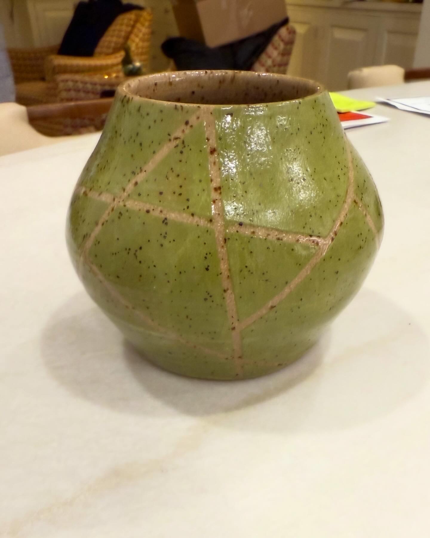 Green speckled vase with carved geometric lines